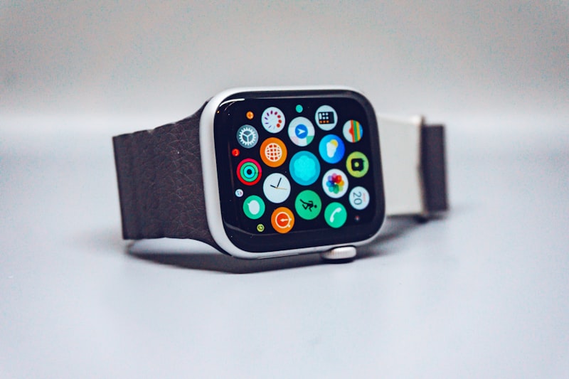 Apple Watch and iPhone side by side on a desk