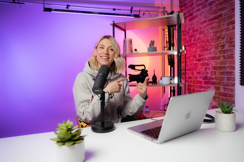 Solo content creator at a desk with a phone on a tripod ready to record